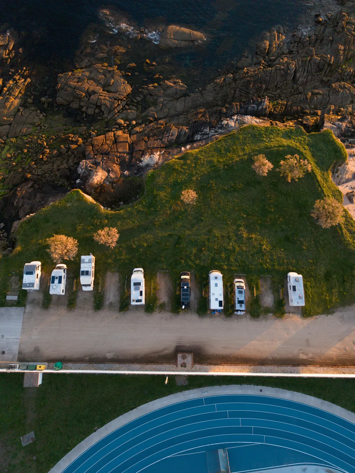 Aerial view of RVs and trailers parked in neat rows in an outdoor storage lot